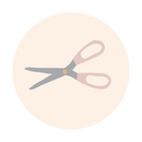 Icon of open scissors with grey blades and pinkish-brown handles.
